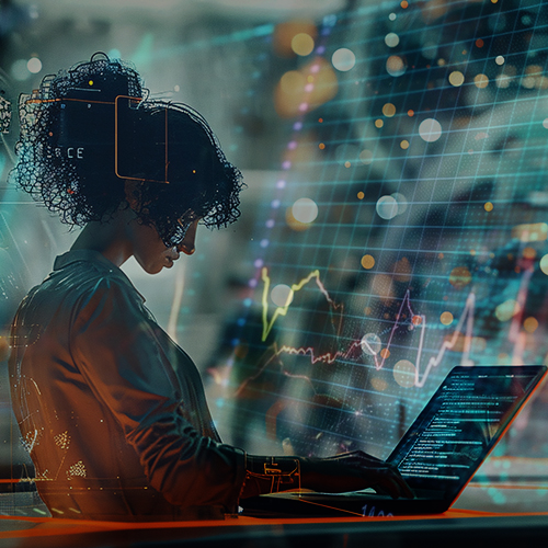 uma mulher de perfil, de cabelos crespos, está em um ambiente tecnológico fazendo uso de um notebook para dar a entender que ela está trabalhando na automação de processos